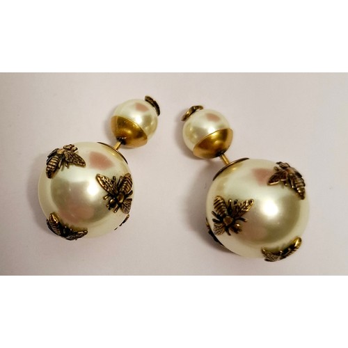 6 - Christian Dior-A pair of 'Mise en Dior Tribal Bee' gold tone and simulated pearl earrings with bee d... 