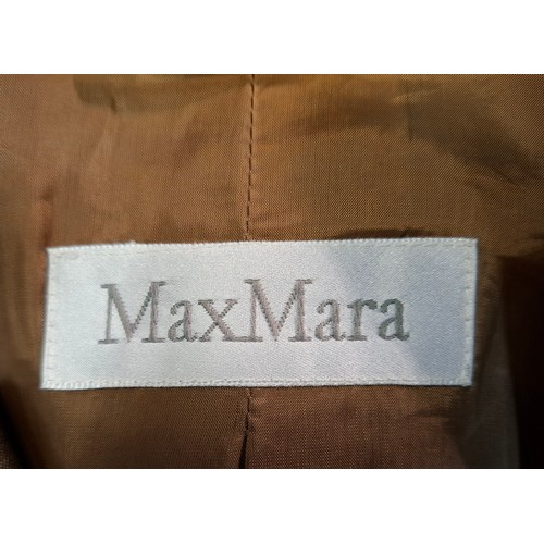 21 - Max Mara- A group of ladies clothing to include a brown leather skirt UK14. Location:Rail
If there i... 