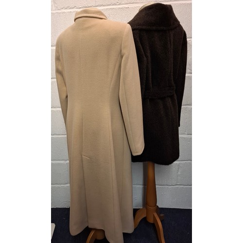 54 - Erre, South Africa- Two ladies coats comprising a blonde cashmere full length coat, UK14, having a g... 