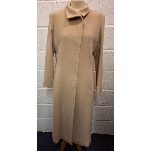 54 - Erre, South Africa- Two ladies coats comprising a blonde cashmere full length coat, UK14, having a g... 