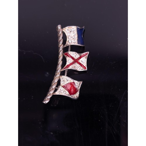 321 - A vintage enamel and crystal set All Volunteer Force Military Signal flag brooch

Location: CAB1
If ... 