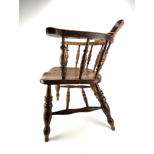 301 - An early 20th century beech and elm smokers bow chair, with a spindle back and turned legs

Location... 