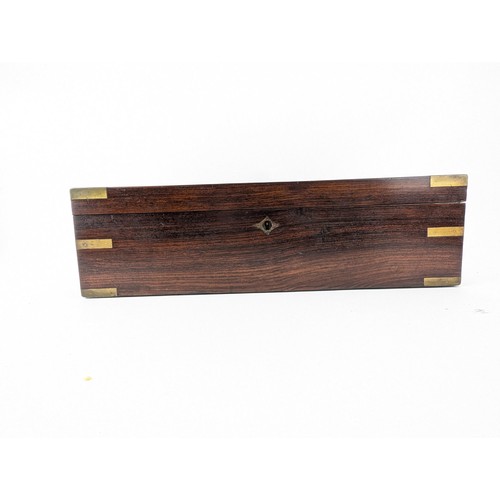 306 - A Victorian mahogany writing slope with brass banding and corners, enclosing a fitted interior and w... 