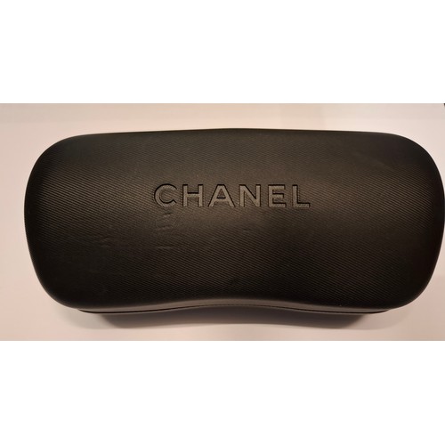 27 - Chanel- A pair of black oversized sunglasses A/F, model:5083 with branded case and box. Location:R2.... 