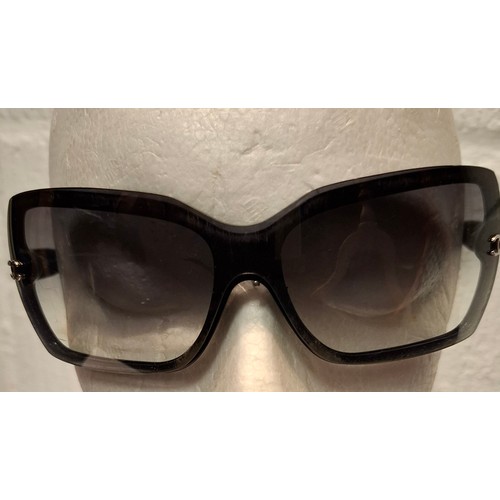 27 - Chanel- A pair of black oversized sunglasses A/F, model:5083 with branded case and box. Location:R2.... 