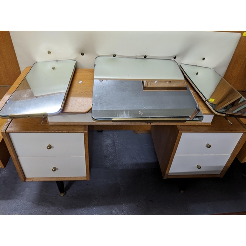 74 - A mid century Ebenzer Gomme for G-Plan continental dressing table from the China White range, blond ... 