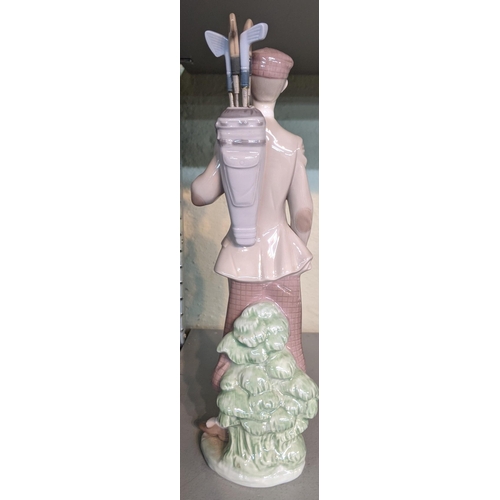 329 - A porcelain Lladro figurine of a golfer, titled Waiting to tee off from 1985, 29cm
Location 5.2
If t... 