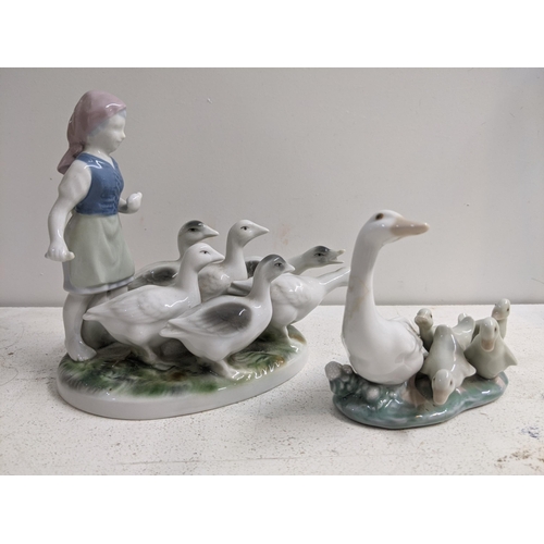 330 - Seven porcelain models, some Lladro, some Noo and other unmarked examples to include; a baby in a co... 