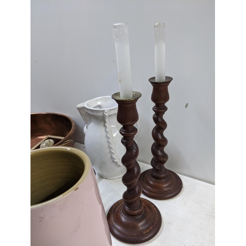 335 - A mixed lot to include two barley twist candlesticks, copper kettles, painted eggs on a big copper b... 