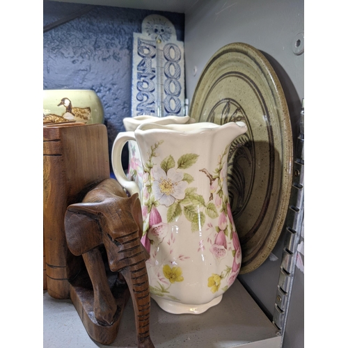 338 - A mixed lot to include studio pottery, a pair of bookends, two pieces of Sylvac pottery, a crackle g... 