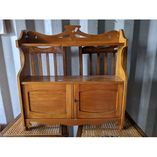 343 - A small pine table with two drawers raised on turned tapered legs along with a pair of light oak din... 