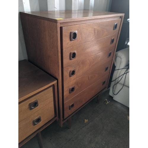 350 - A Wrighton teak chest of drawers with sculpted square handles, five graduating drawers raised on tap... 