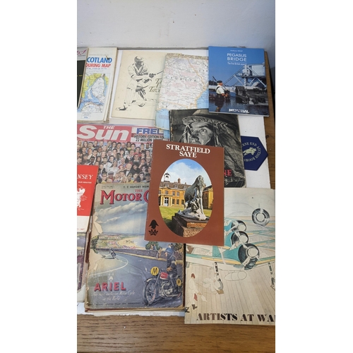 325 - A mixed lot of ephemera to include historical maps from the UK and Europe, cricket programmes, motor... 