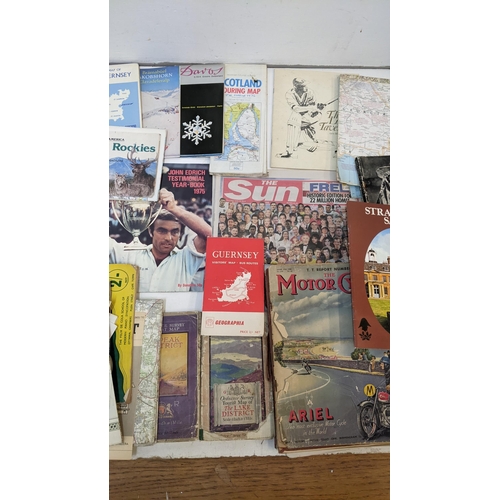 325 - A mixed lot of ephemera to include historical maps from the UK and Europe, cricket programmes, motor... 