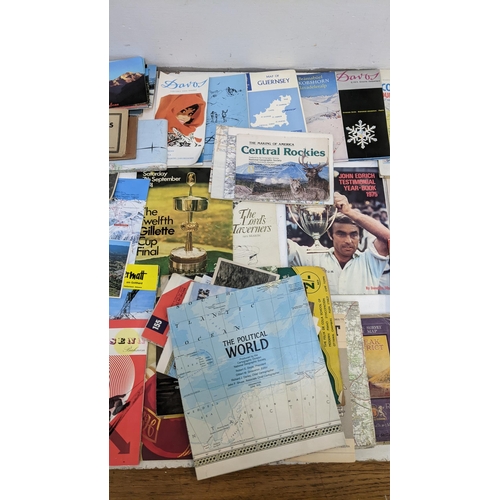 325 - A mixed lot of ephemera to include historical maps from the UK and Europe, cricket programmes, motor... 