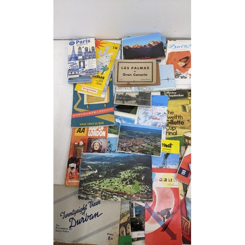 325 - A mixed lot of ephemera to include historical maps from the UK and Europe, cricket programmes, motor... 