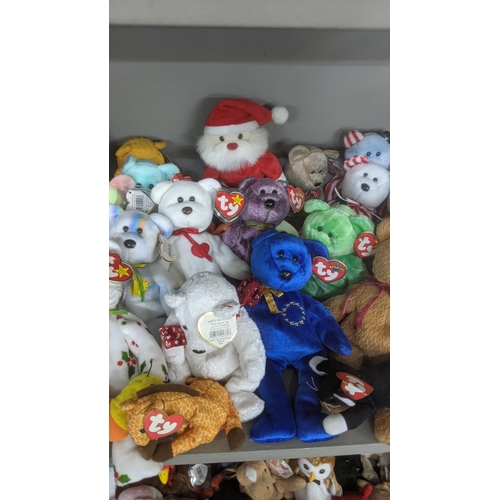 35 - A large collection of TY Beanie Bears, all with original tags, to include Christmas related examples... 