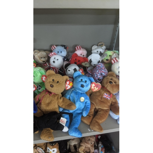 35 - A large collection of TY Beanie Bears, all with original tags, to include Christmas related examples... 