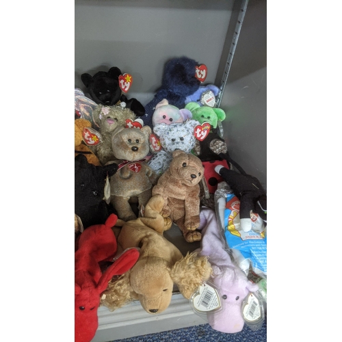 35 - A large collection of TY Beanie Bears, all with original tags, to include Christmas related examples... 