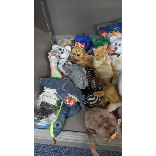 35 - A large collection of TY Beanie Bears, all with original tags, to include Christmas related examples... 