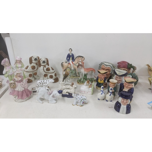 367 - A mixed lot to include Limoges Polar bear, a Lladro lamb, Toby jugs, Royal Doulton character jug, St... 