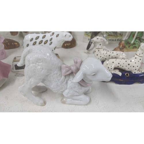 367 - A mixed lot to include Limoges Polar bear, a Lladro lamb, Toby jugs, Royal Doulton character jug, St... 