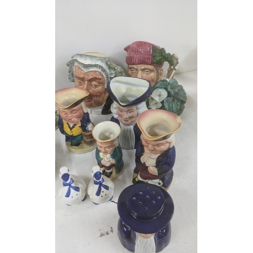 367 - A mixed lot to include Limoges Polar bear, a Lladro lamb, Toby jugs, Royal Doulton character jug, St... 