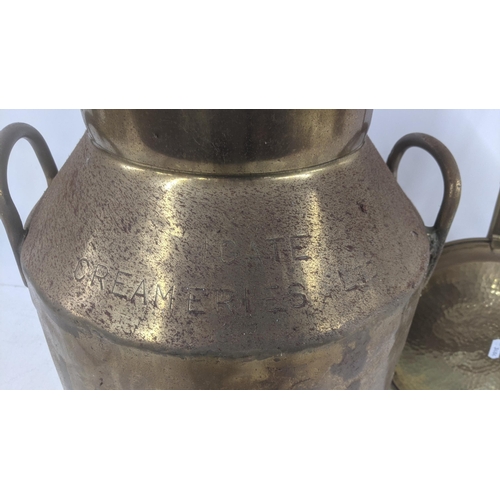 373 - A vintage brass milk churn stamped Igate Creameries Ltd 14651 Y, 51cm high, together with a brass be... 