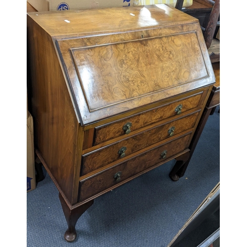 378 - A reproduction burr walnut bureau in the Queen Anne style, 98cm h x 77cm w
Location: A3F
If there is... 