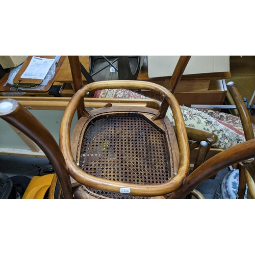 392 - A set of eight Bentwood chairs in the style of Oka Camargue chairs with X shaped backs and can woven... 