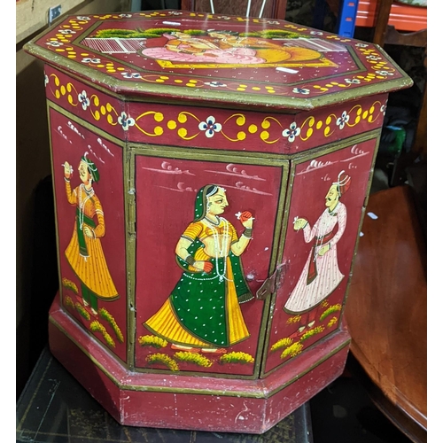 395 - An Indian Rajashoni courtship stool storage box of octagonal form and painted with figures on a red ... 