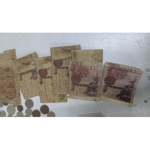 41 - A collection of mostly foreign coinage and bank notes, tickets, Egypt 1 pounds and others, French Br... 