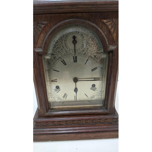 412 - An early 20th century oak cased mantle clock with a Westminster chime
Location RAF
If there is no co... 