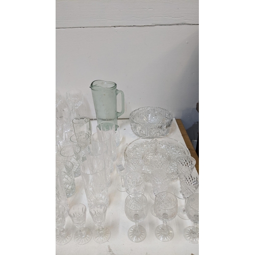 418 - A collection of crystal glassware to include decanters, wine glasses and others
Location: G
If there... 