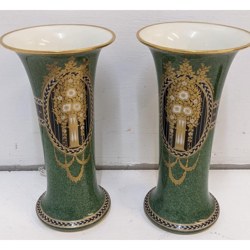 424 - A Pair of Royal Worcester vases with a green gold and black design marked 'G923'
Location 6-1
If the... 