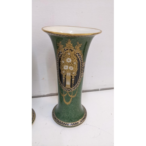 424 - A Pair of Royal Worcester vases with a green gold and black design marked 'G923'
Location 6-1
If the... 