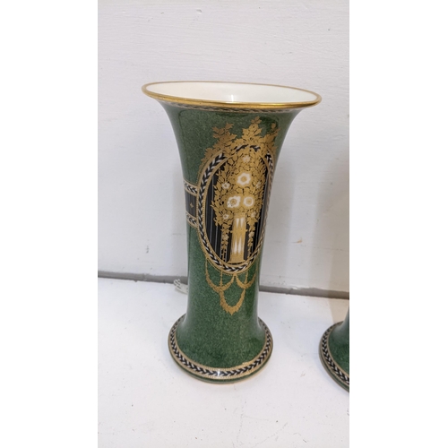 424 - A Pair of Royal Worcester vases with a green gold and black design marked 'G923'
Location 6-1
If the... 