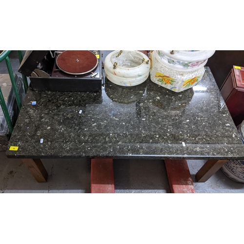 68 - A granite topped coffee table on square wooden legs, 45.5 x 124 x 75, along with a white painted fra... 