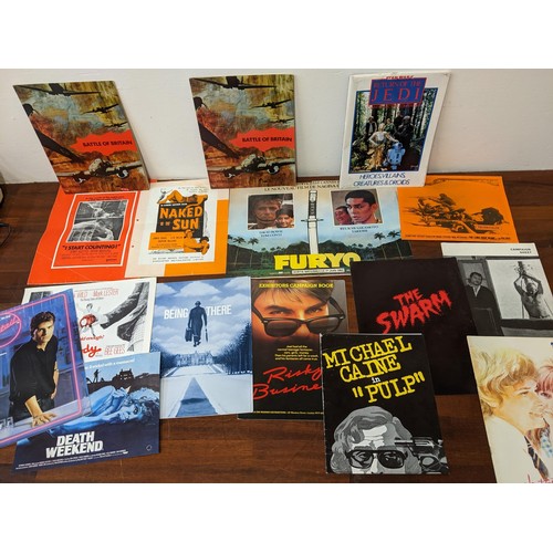 396 - A large collection of film publicity stills. posters and film campaign books to include examples fro... 