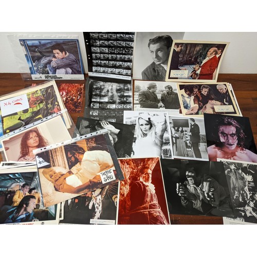 396 - A large collection of film publicity stills. posters and film campaign books to include examples fro... 