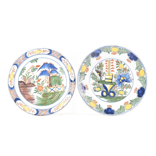 525 - Two 18th century Dutch Delft polychrome plates, one depicting a still life of flowers and a table in... 