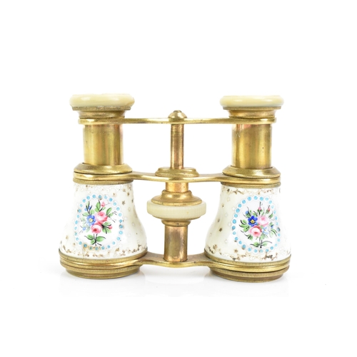 471 - A pair of late 19th century French gilt metal and porcelain opera glasses, painted with four floral ... 