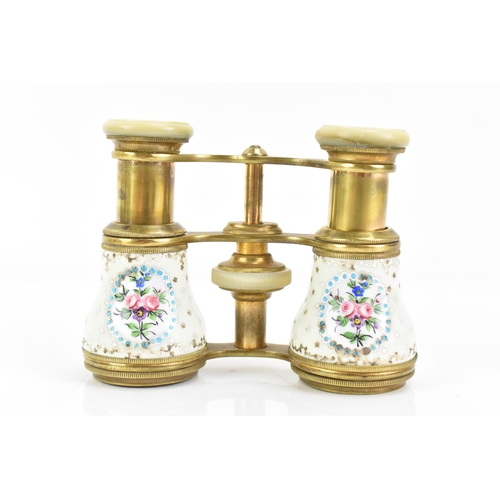 471 - A pair of late 19th century French gilt metal and porcelain opera glasses, painted with four floral ... 