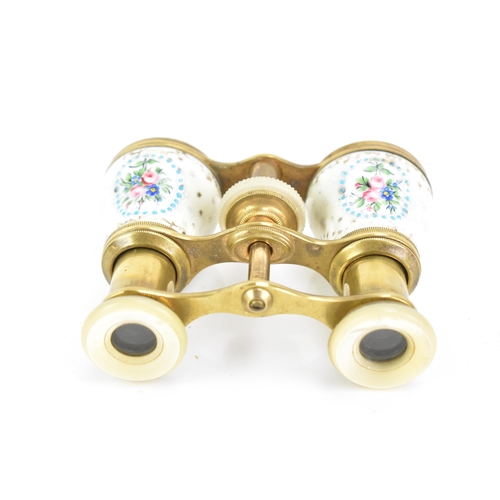 471 - A pair of late 19th century French gilt metal and porcelain opera glasses, painted with four floral ... 