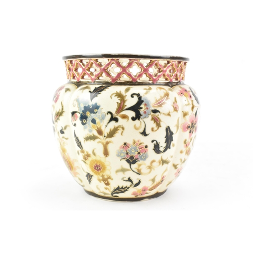 476 - A circa 1900 century Hungarian Zsolnay Pecs vase, having a pierced rim, ovoid body painted with flow... 