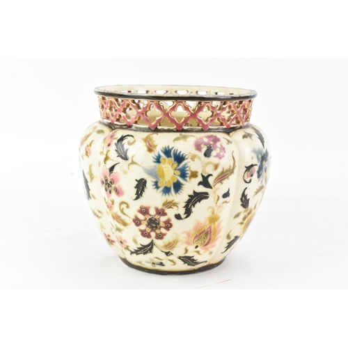 476 - A circa 1900 century Hungarian Zsolnay Pecs vase, having a pierced rim, ovoid body painted with flow... 