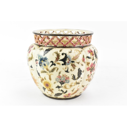 476 - A circa 1900 century Hungarian Zsolnay Pecs vase, having a pierced rim, ovoid body painted with flow... 