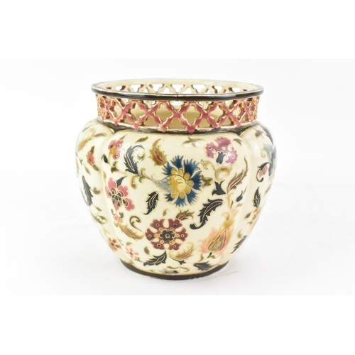 476 - A circa 1900 century Hungarian Zsolnay Pecs vase, having a pierced rim, ovoid body painted with flow... 