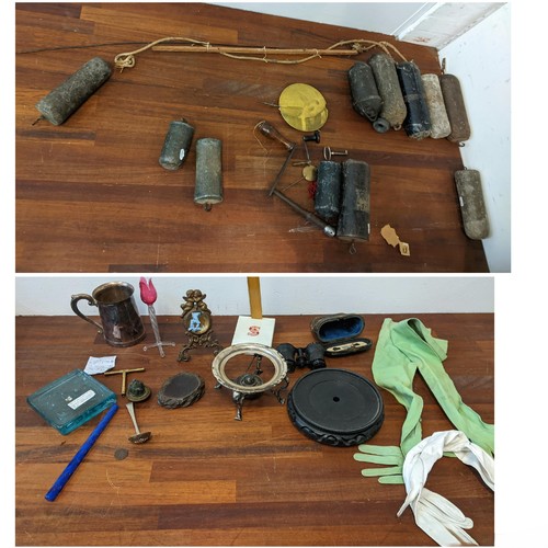 531 - A mixed lot to include clock parts lead and other longcase clock weights, pendulum parts and keys, t... 