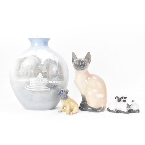 506 - Three Royal Copenhagen porcelain ornaments and a vase to include a Siamese cat model no. 2851/3281, ... 